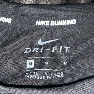 Nike Women's Dri-Fit Reflective Running Hi Low Long Sleeve Shirt. Size medium.